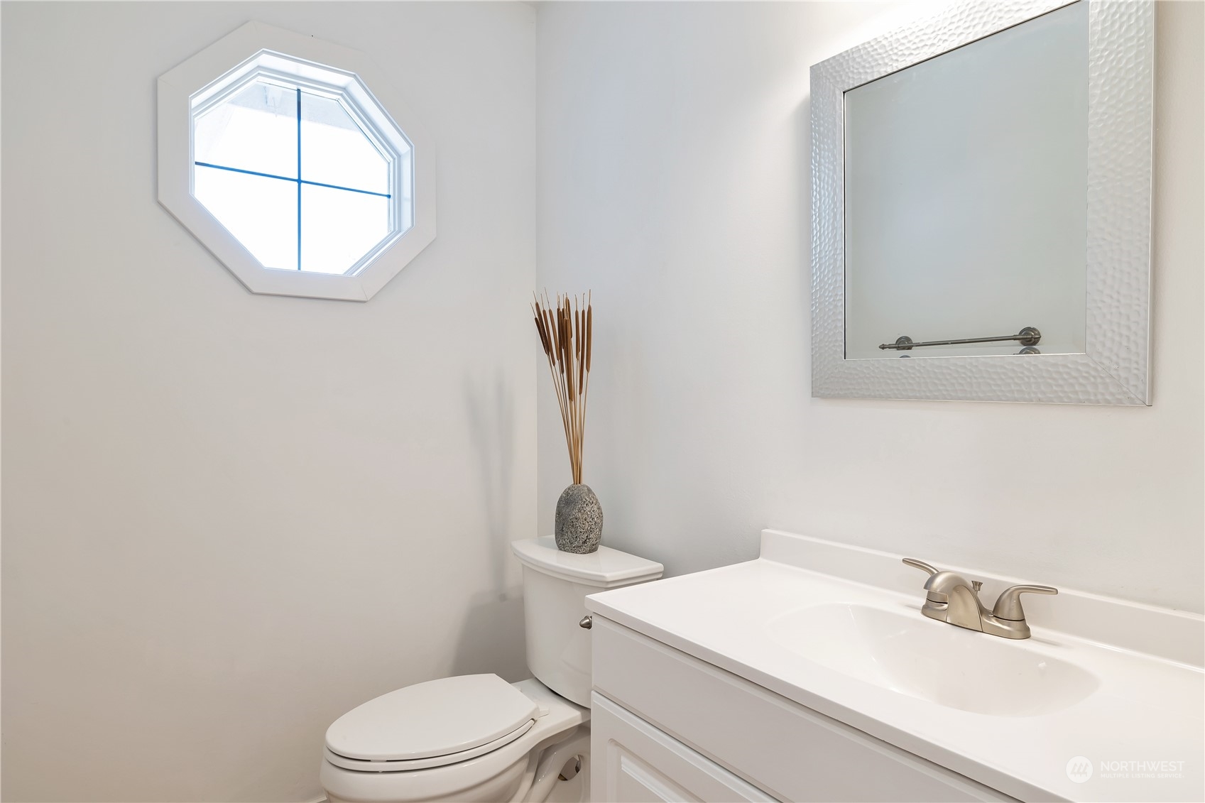 2926 184th Place Southeast Bothell, WA 98012 - Photo 8 of 24 a bathroom with a toilet a sink and mirror