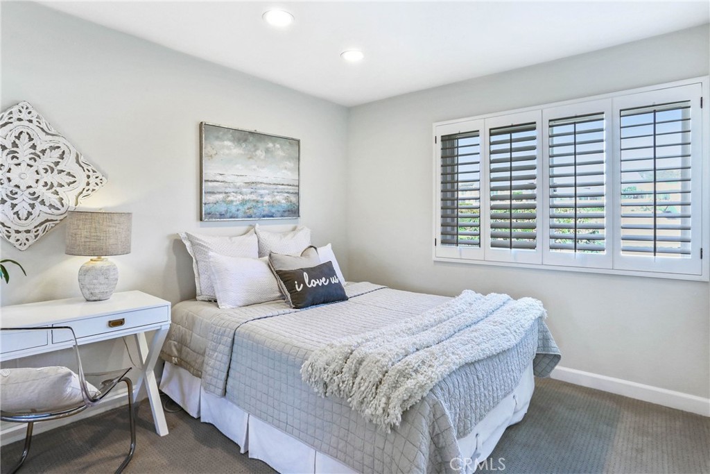 33885 Manta Court Dana Point, CA 92629 - Photo 13 of 34 a bedroom with a bed and a large window