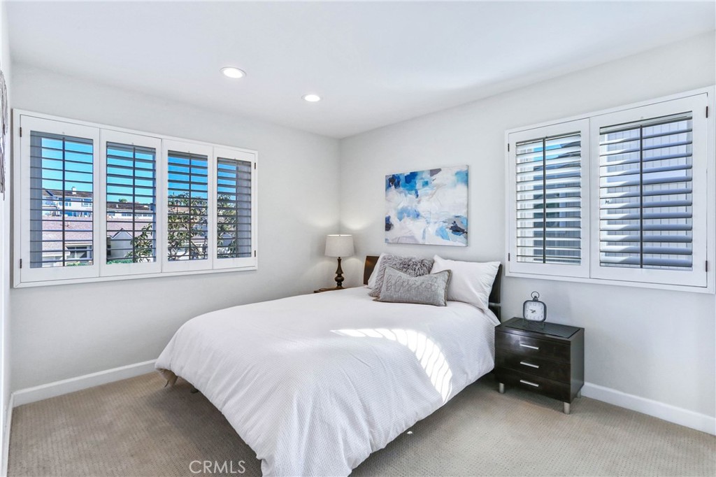33885 Manta Court Dana Point, CA 92629 - Photo 15 of 34 a bedroom with a bed and a large window