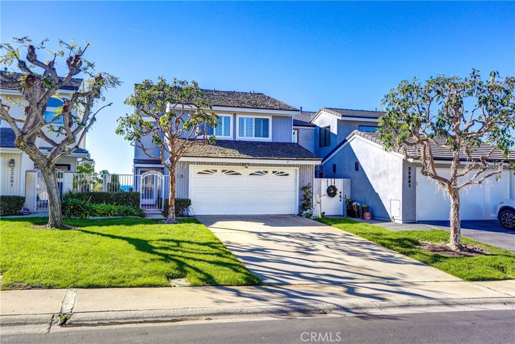 33885 Manta Court Dana Point, CA 92629 - Photo 16 of 34 a view of a house with a small yard and large trees