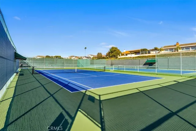 a view of an outdoor space and tennis court