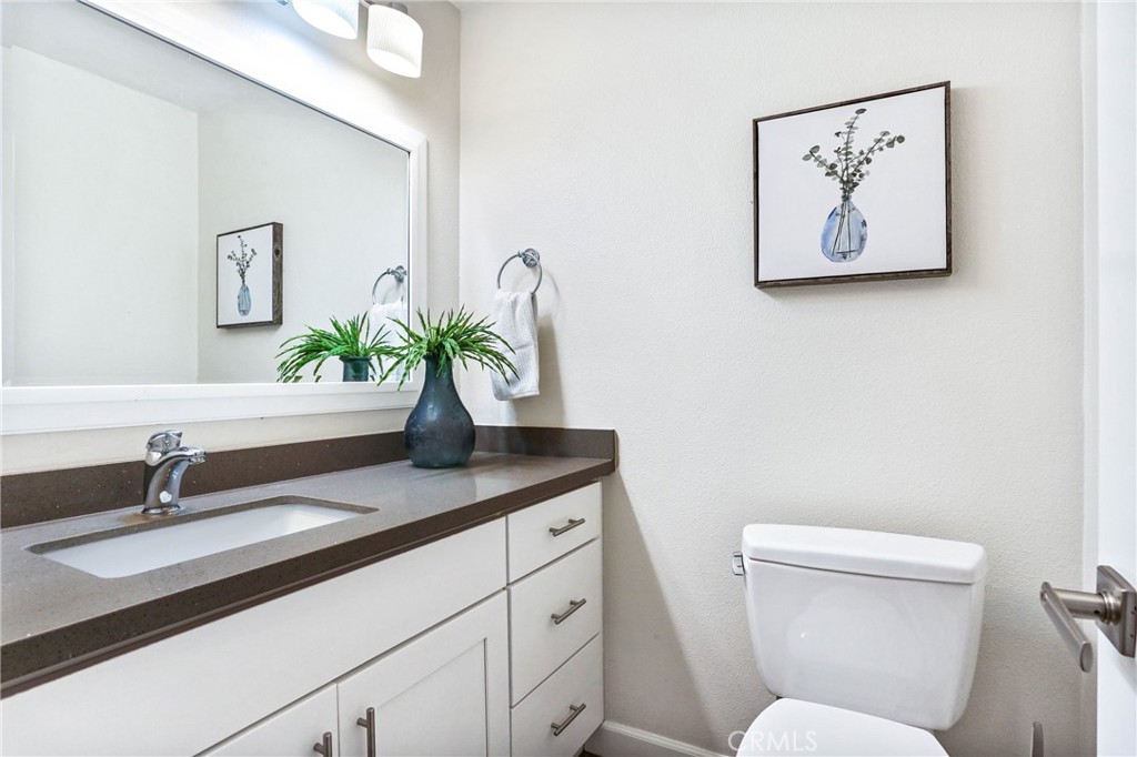 33885 Manta Court Dana Point, CA 92629 - Photo 8 of 34 a bathroom with a toilet sink and mirror