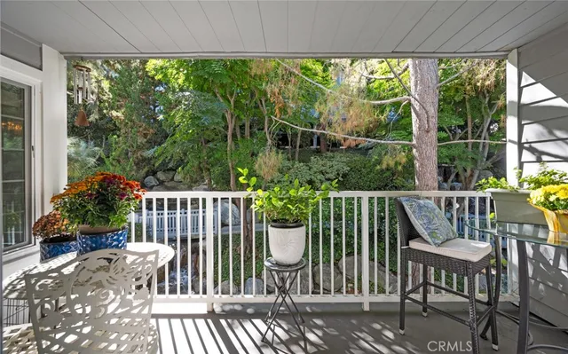 a view of a chair and table on the patio