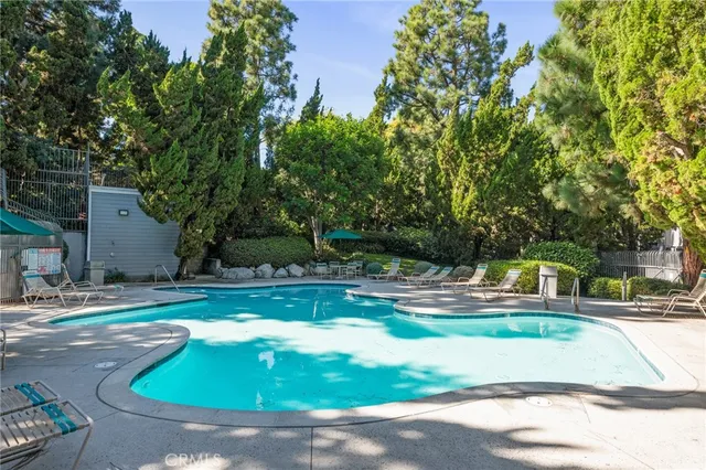 a view of a swimming pool with a sitting area
