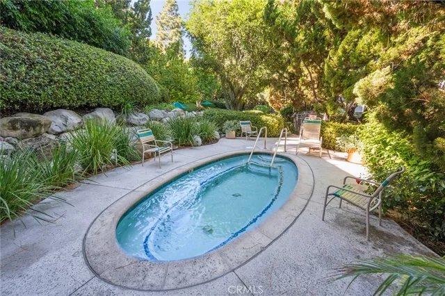 a view of a swimming pool with a yard