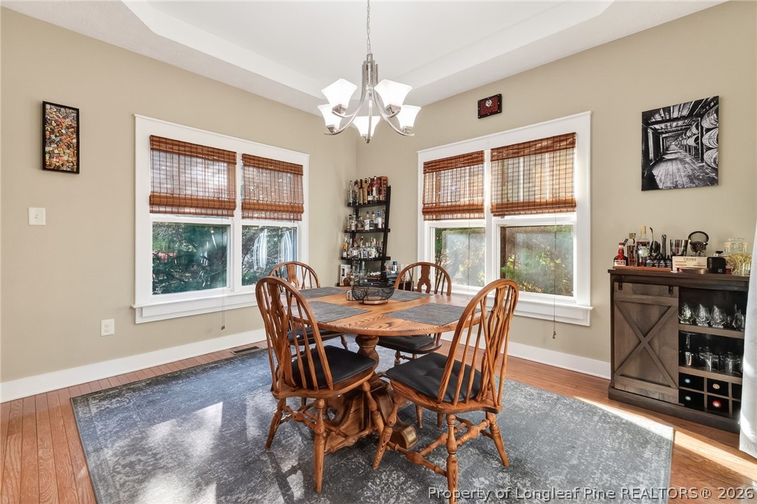 124 Riviera Lane Sanford, NC 27332 - Photo 12 of 45 a view of a dining room with furniture window and wooden floor