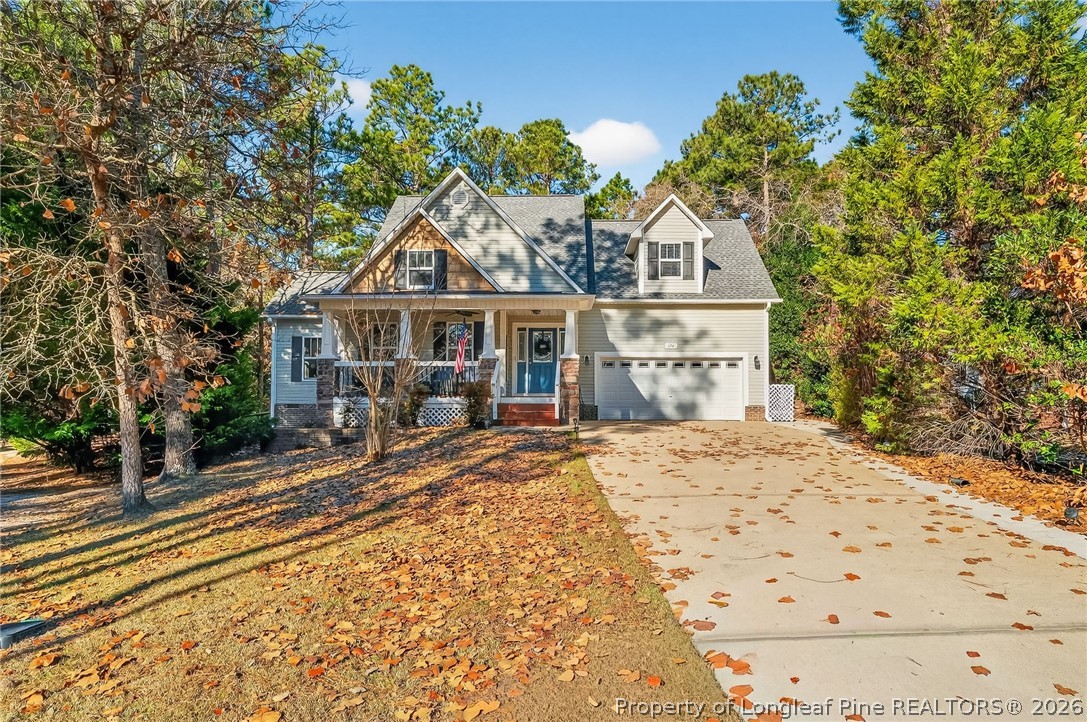 124 Riviera Lane Sanford, NC 27332 - Photo 2 of 45 a front view of a house with a garden