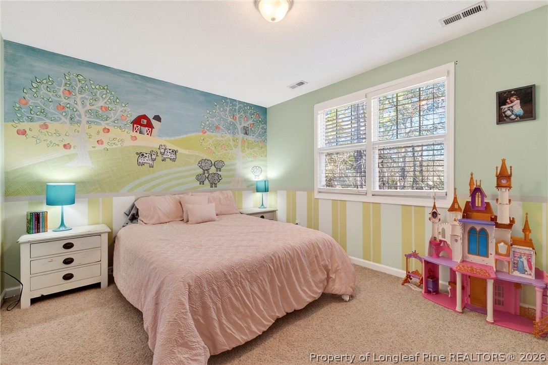 124 Riviera Lane Sanford, NC 27332 - Photo 31 of 45 a bedroom with a bed and a window