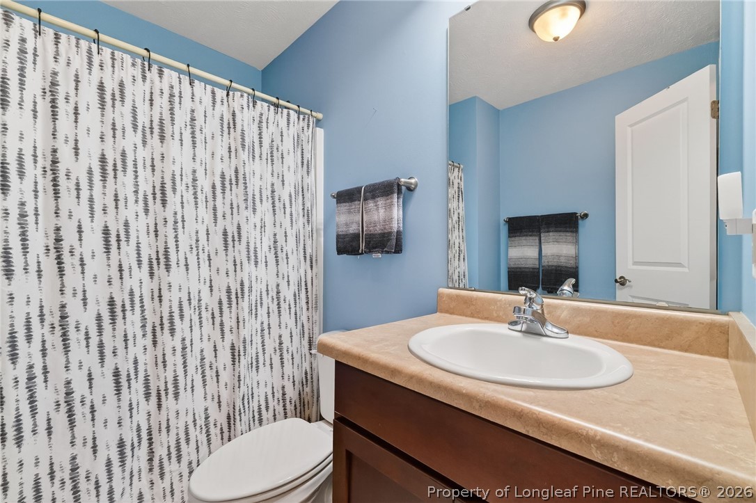 124 Riviera Lane Sanford, NC 27332 - Photo 34 of 45 a bathroom with a sink toilet and shower