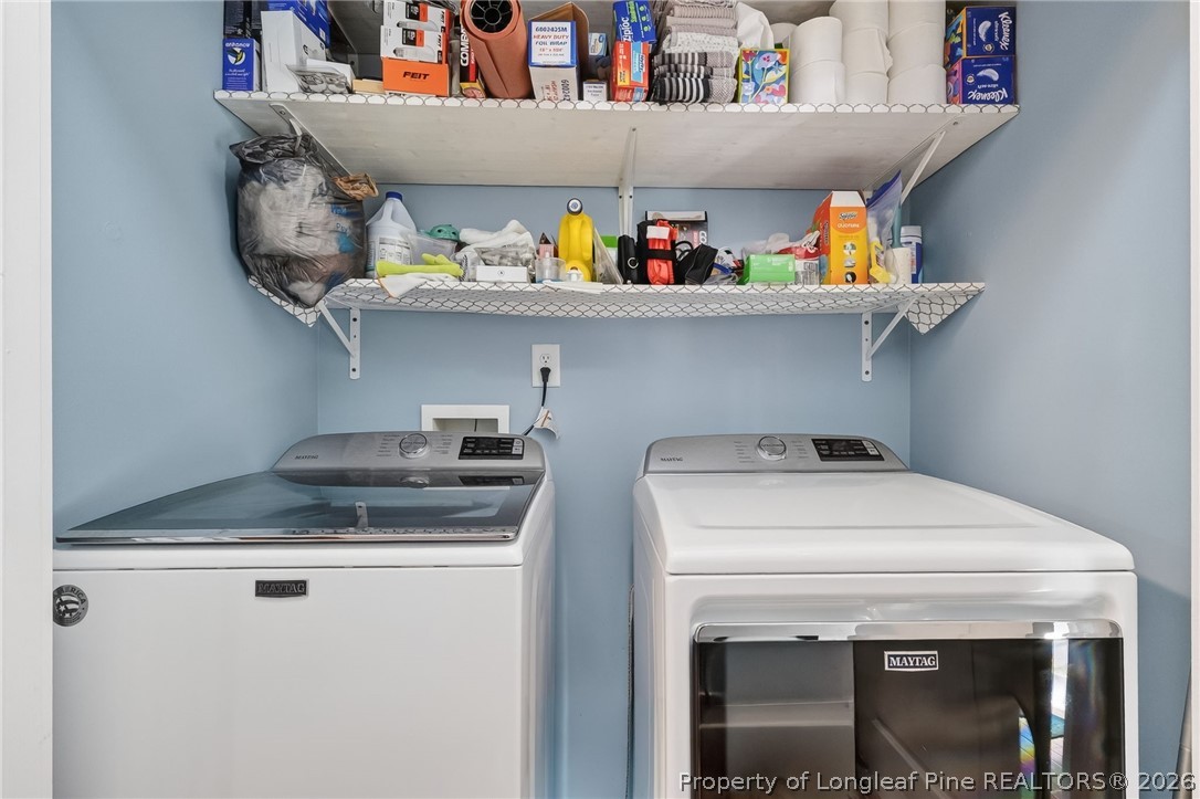 124 Riviera Lane Sanford, NC 27332 - Photo 35 of 45 a utility room with dryer and washer