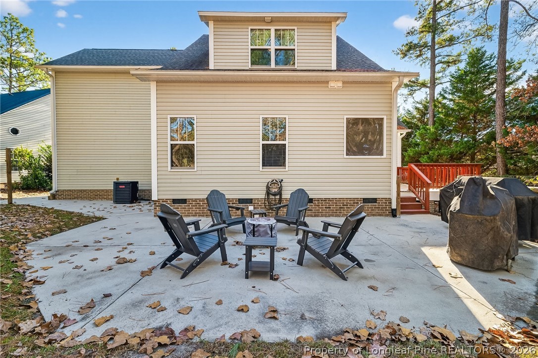 124 Riviera Lane Sanford, NC 27332 - Photo 38 of 45 a backyard of a house with table and chairs