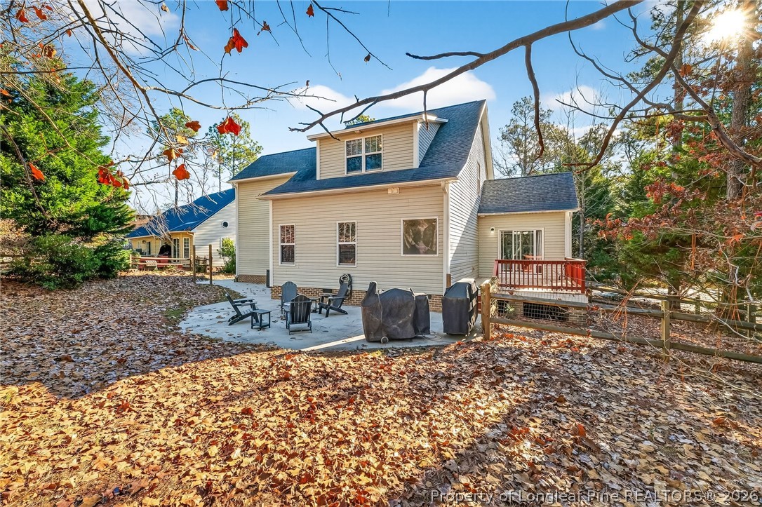 124 Riviera Lane Sanford, NC 27332 - Photo 39 of 45 a view of a patio with a table and chairs under an umbrella
