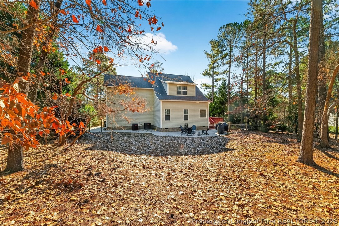 124 Riviera Lane Sanford, NC 27332 - Photo 41 of 45 a view of a white house with a sink and yard