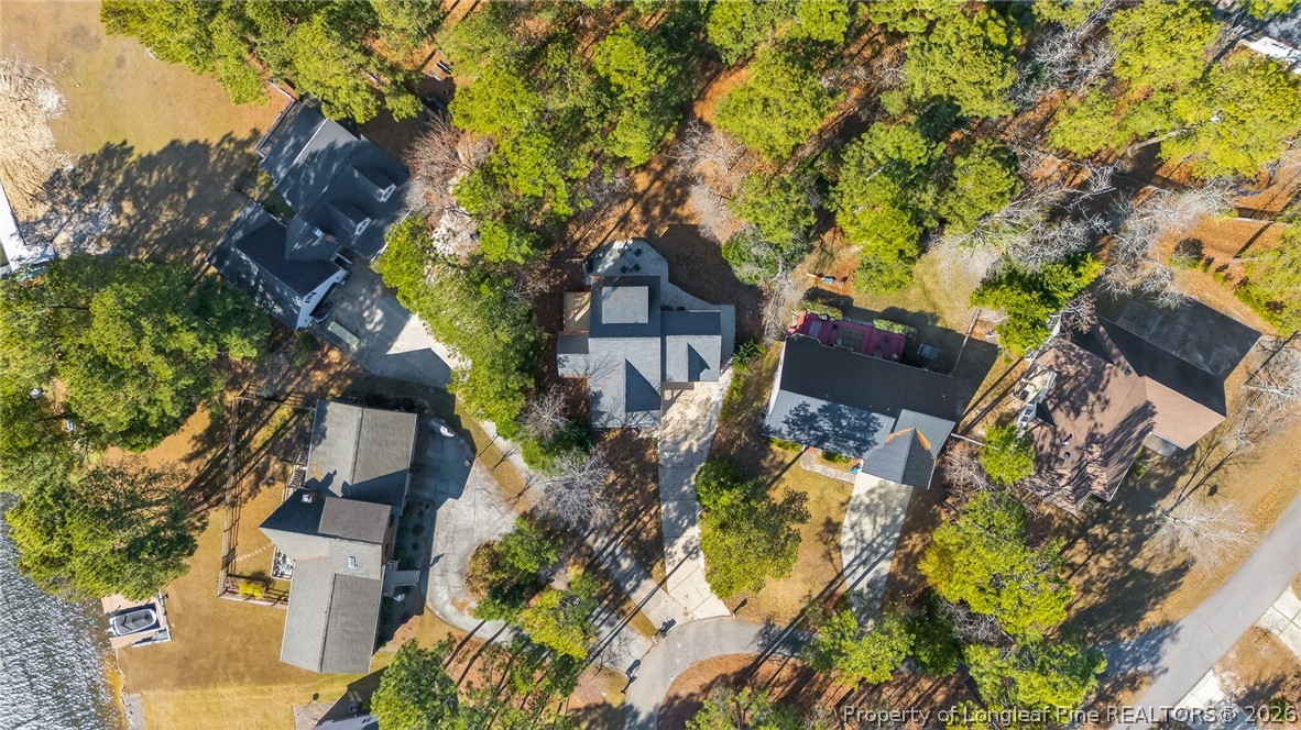 124 Riviera Lane Sanford, NC 27332 - Photo 43 of 45 an aerial view of a house with a yard and large trees
