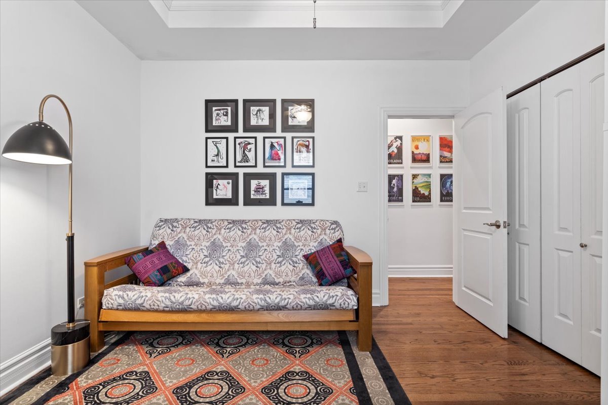1048 West Lawrence Avenue, Unit 2 Chicago, IL 60640 - Photo 13 of 16 a living room with furniture and wooden floor