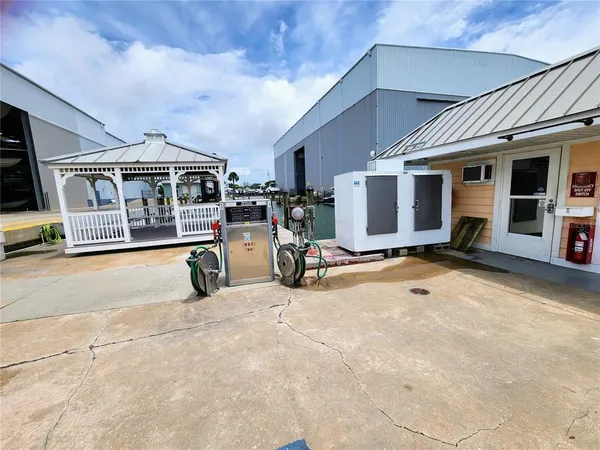 a view of a porch with furniture and a yard