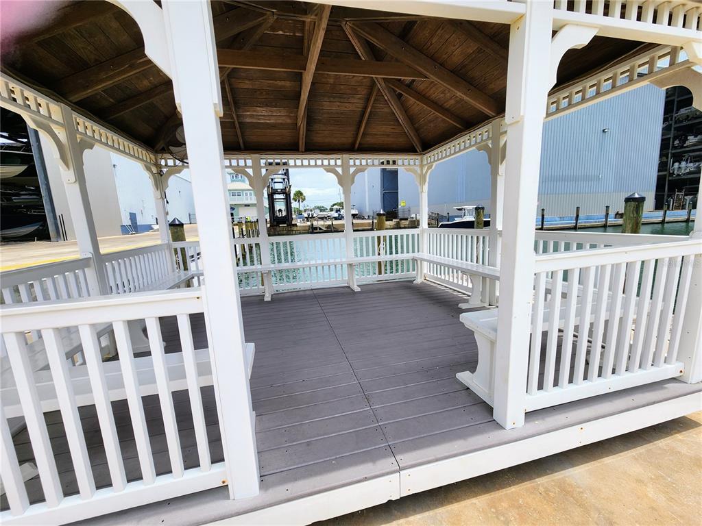 100 Circuit Road, Unit S35 Nokomis, FL 34275 - Photo 15 of 35 a view of a porch with furniture and a yard