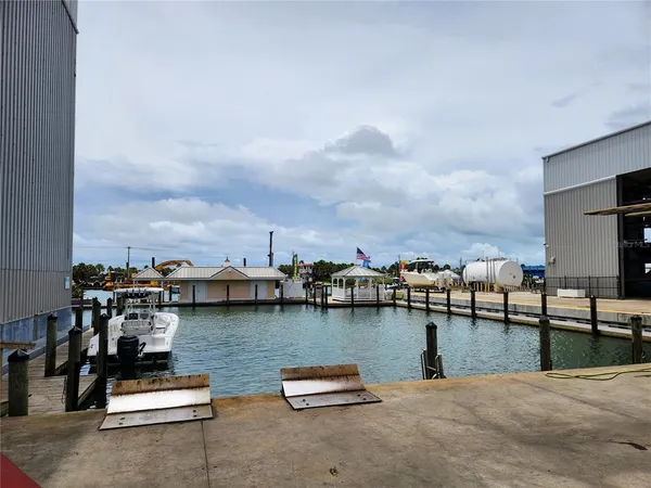 a view of swimming pool with a table and chairs