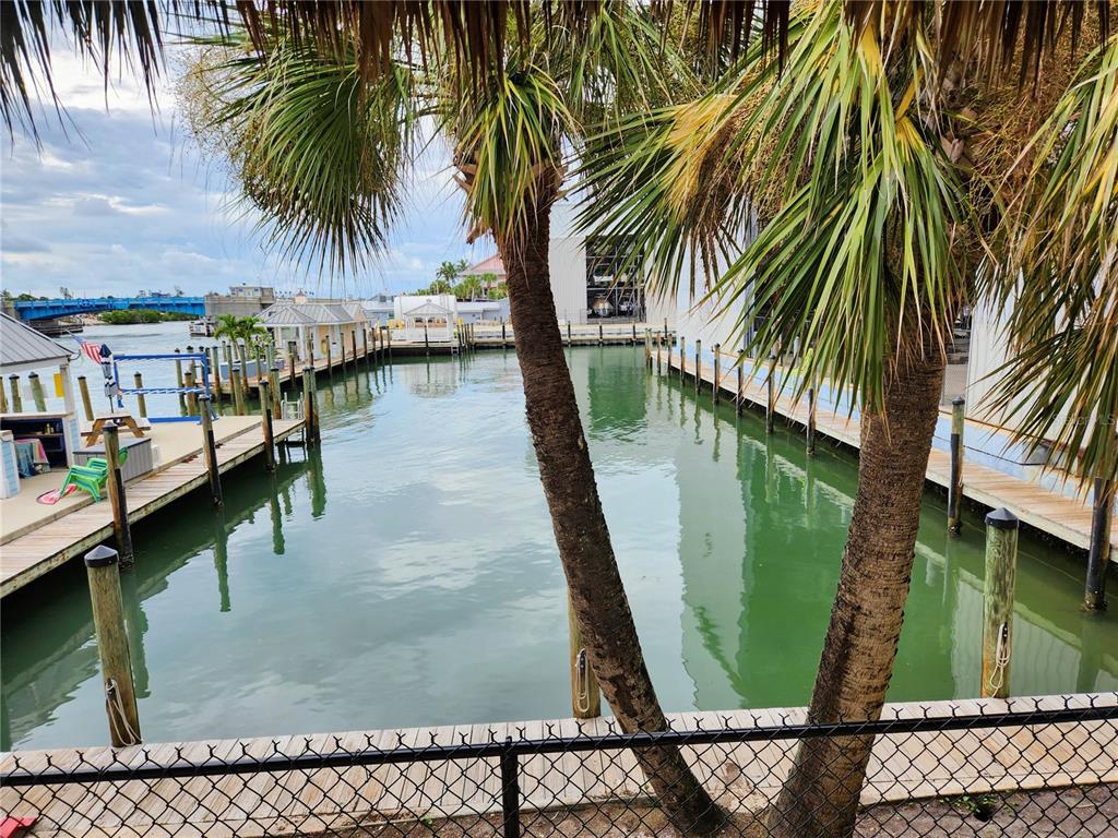 100 Circuit Road, Unit S35 Nokomis, FL 34275 - Photo 22 of 35 a view of swimming pool with a table and chairs