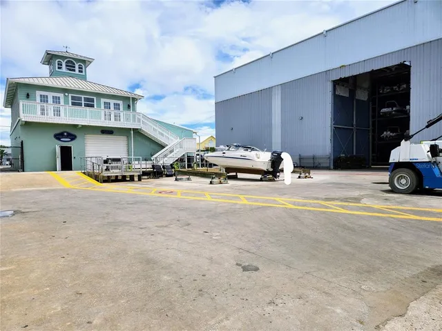 a view of swimming pool with a table and chairs