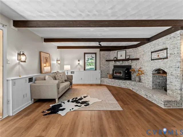 a view of a livingroom with furniture and wooden floor