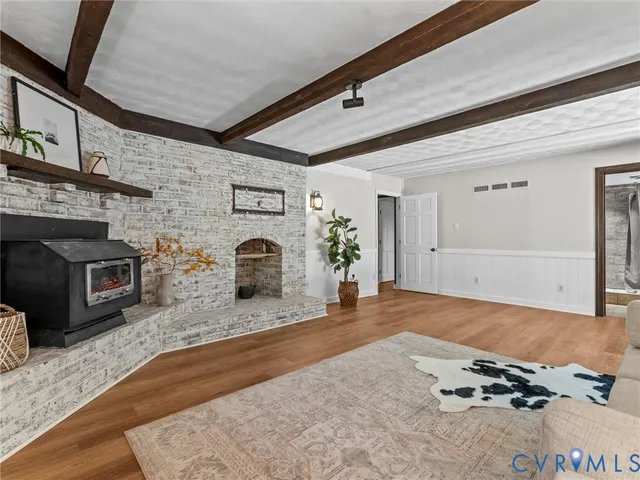 a room with a fireplace and a fireplace