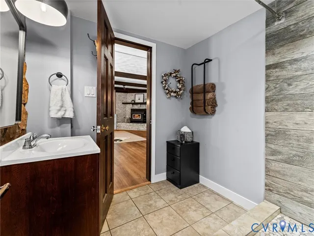 a view of a kitchen with refrigerator and wooden floor