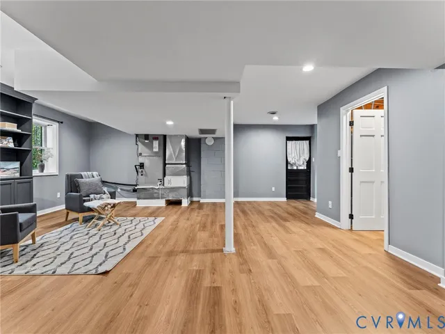 a view of a livingroom with furniture and an empty room