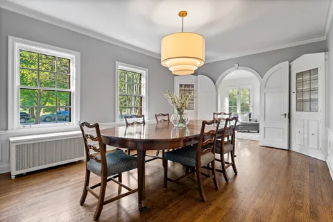 a view of a dining room with furniture window and wooden floor