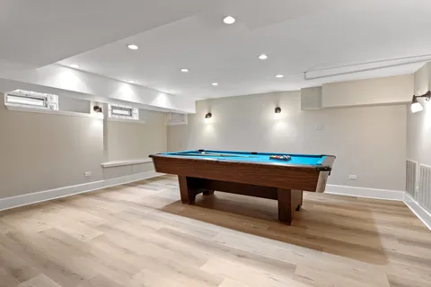 a room with wooden floor and furniture