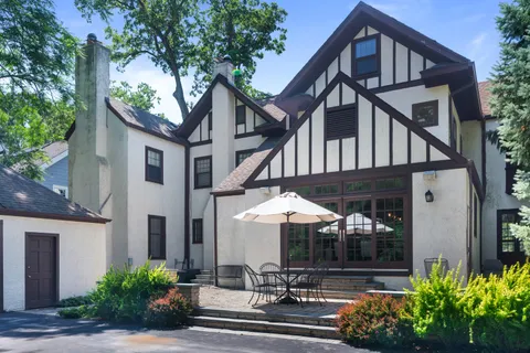 a front view of a house with lots of green space