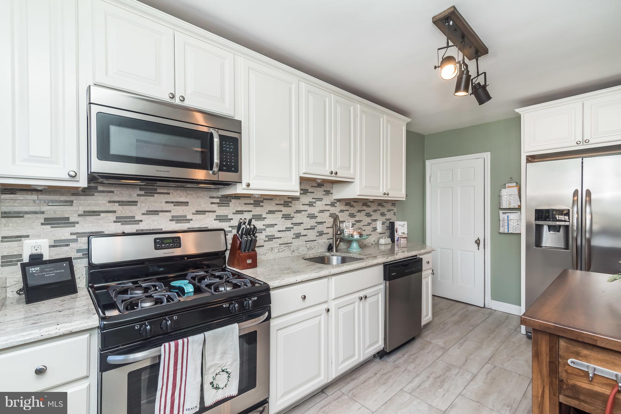 358 Greenlow Road Baltimore, MD 21228 - Photo 9 of 34 Granite counters, brushed nickel hardware