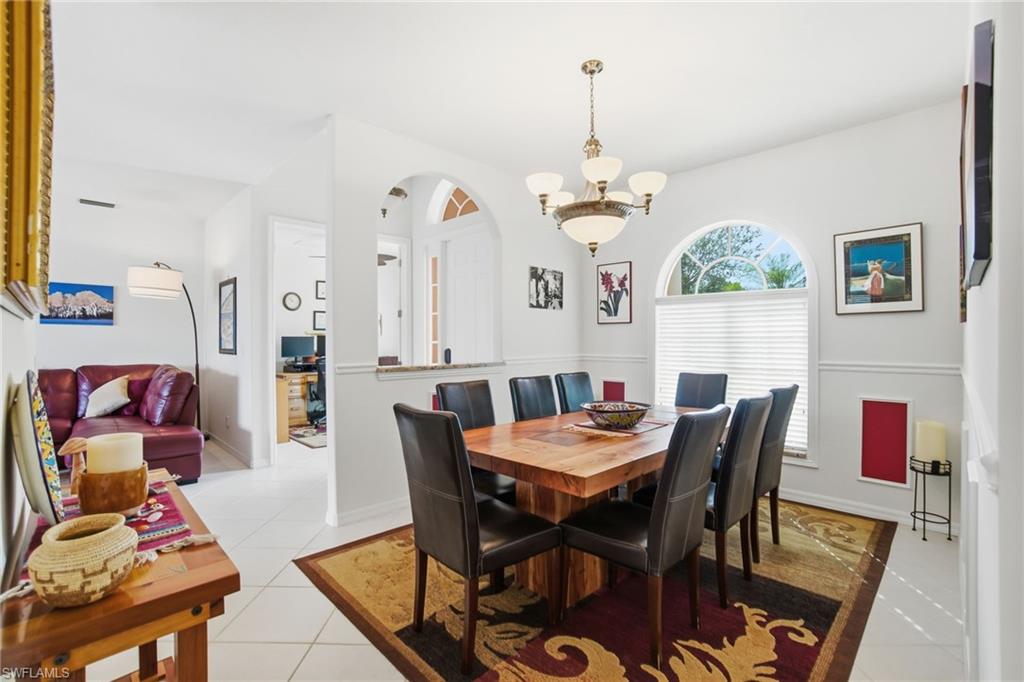 3948 Ruxton Road Naples, FL 34116 - Photo 15 of 43 a view of a dining room with furniture