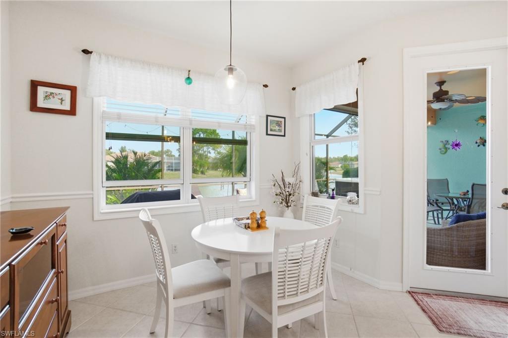 3948 Ruxton Road Naples, FL 34116 - Photo 17 of 43 a view of a dining room with furniture window and outside view