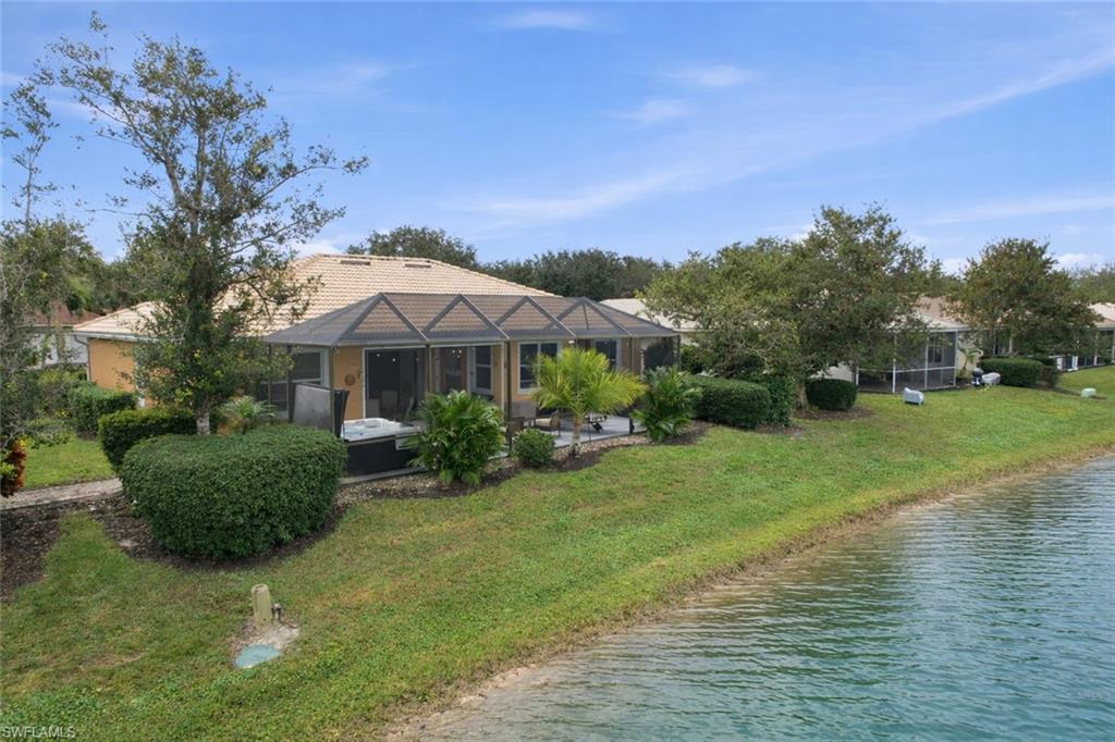3948 Ruxton Road Naples, FL 34116 - Photo 38 of 43 a front view of a house with garden
