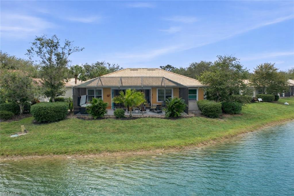 3948 Ruxton Road Naples, FL 34116 - Photo 5 of 43 a view of a house with a yard and sitting area