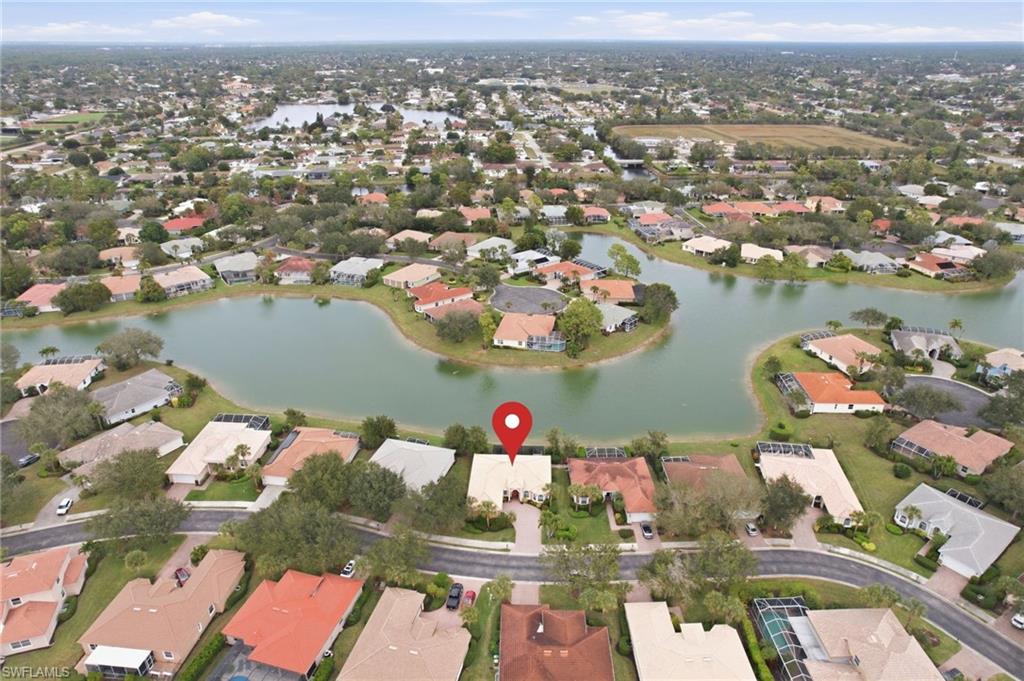 3948 Ruxton Road Naples, FL 34116 - Photo 6 of 43 an aerial view of residential houses with outdoor space and lake view
