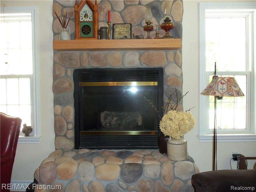 9906 Bergin Road Howell, MI 48843 - Photo 22 of 31 FIREPLACE IN LIVING ROOM