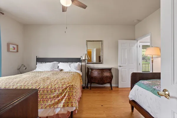 a kitchen with a table chairs and a wooden floor
