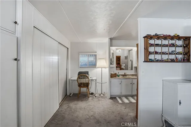 a view of kitchen with windows electronic appliances and furniture