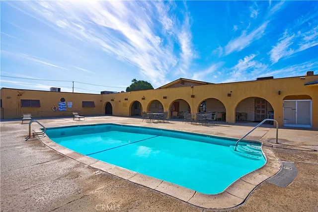 a view of swimming pool with a backyard