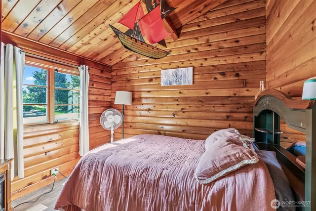 a bed room with a bed and a fireplace