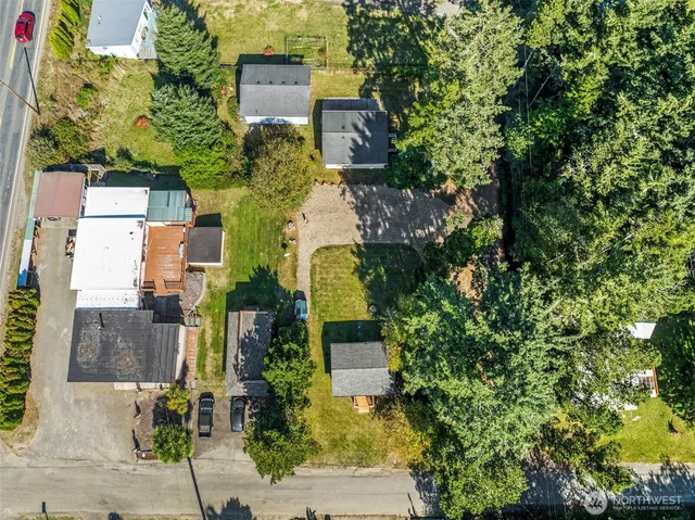 an aerial view of residential houses with outdoor space