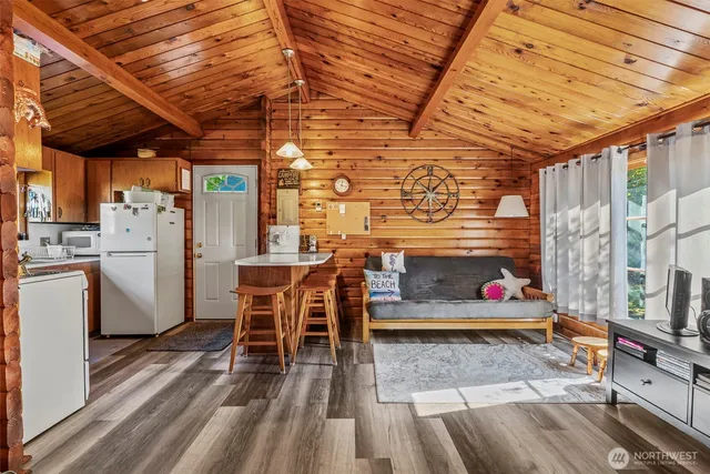 a patio with glass top table and chairs