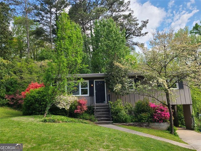 3076 Dove Way Decatur, GA 30033 - Photo 1 of 1 a view of a potted plants in a yard next to a house
