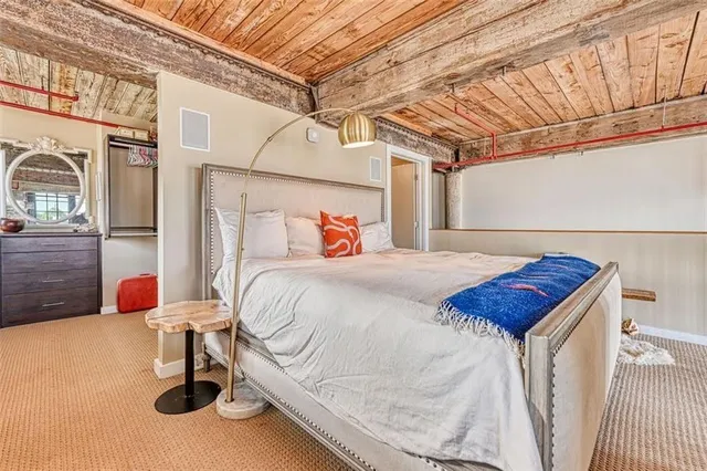 a bedroom with a bed and window