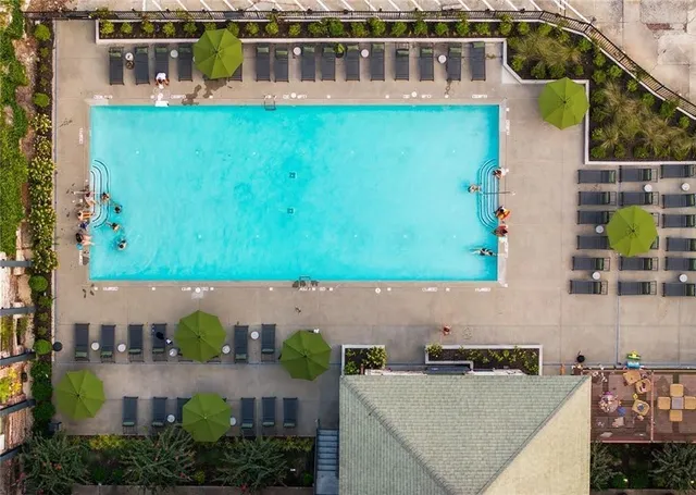an aerial view of a house with a yard basket ball court and outdoor seating