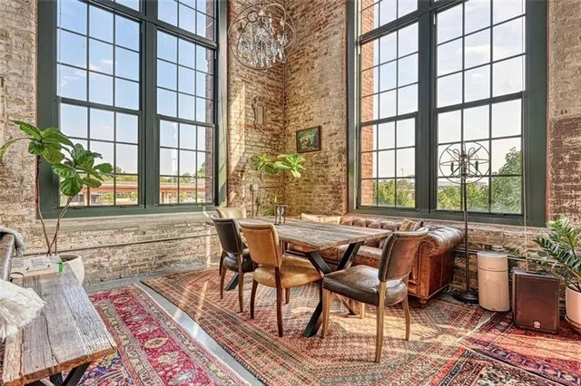 a dining room with furniture and wooden floor
