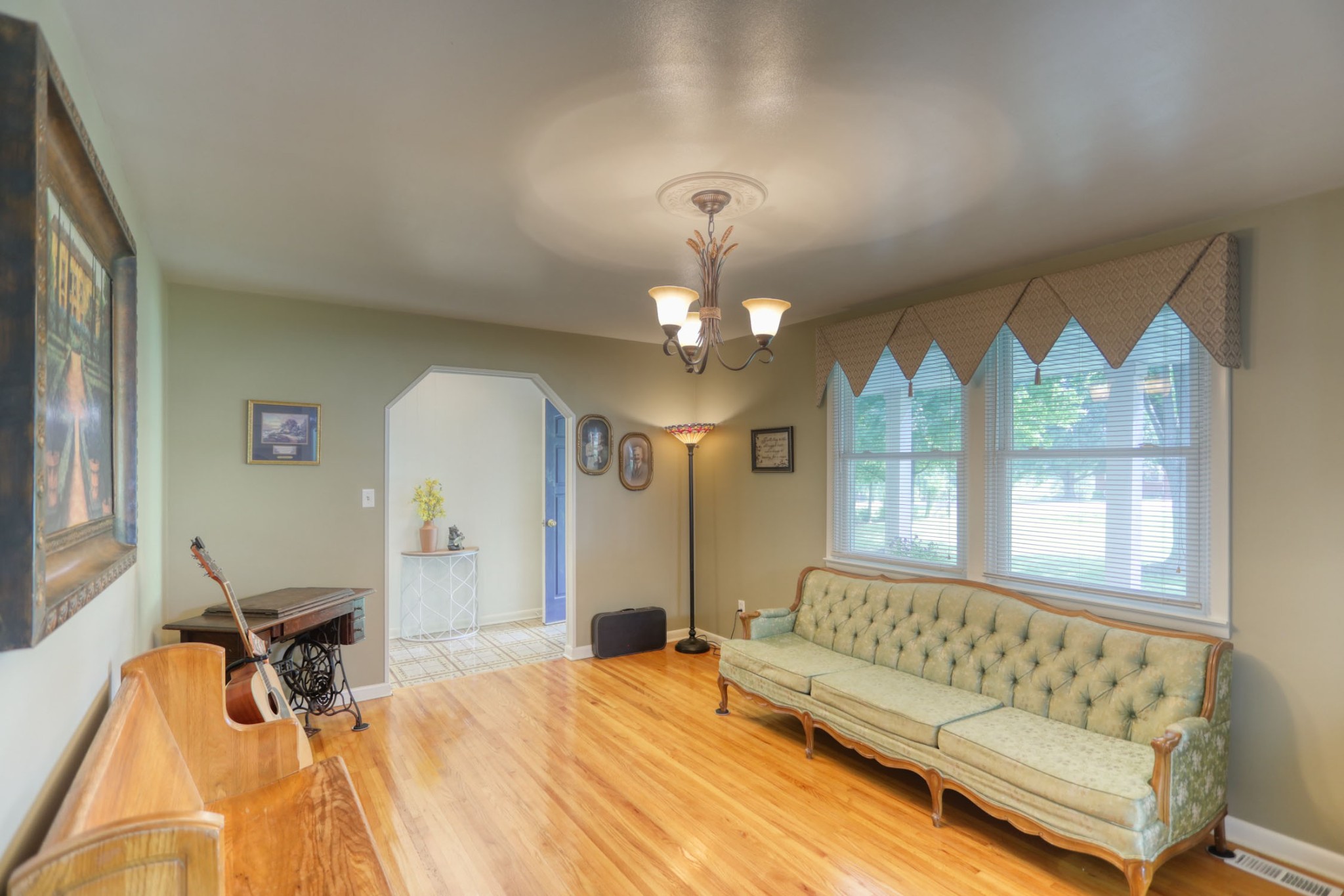 4644 East Robertson Road Cross Plains, TN 37049 - Photo 17 of 56 a spacious bedroom with a bed and a chandelier