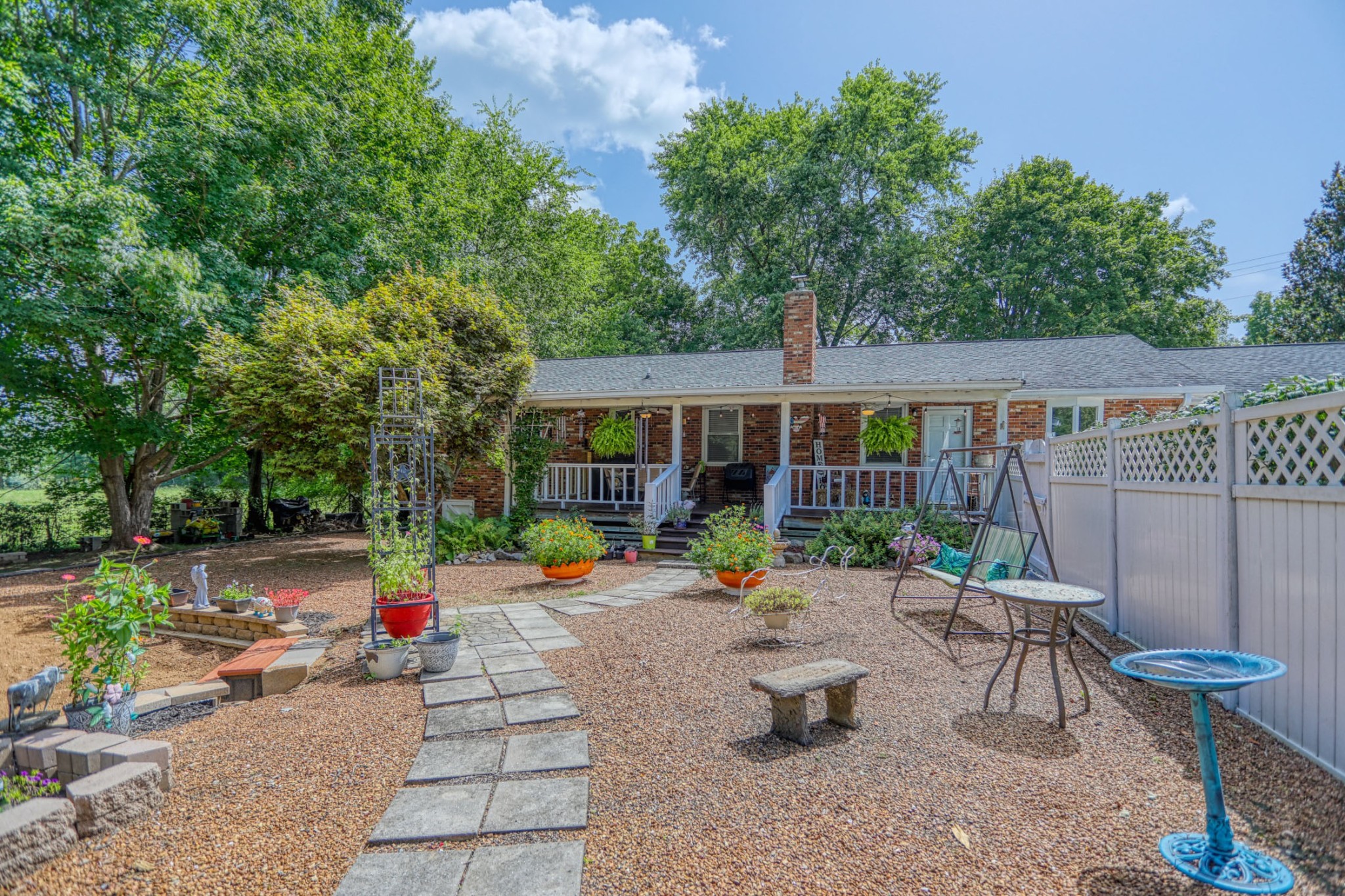 4644 East Robertson Road Cross Plains, TN 37049 - Photo 2 of 56 an outdoor sitting area with furniture and garden
